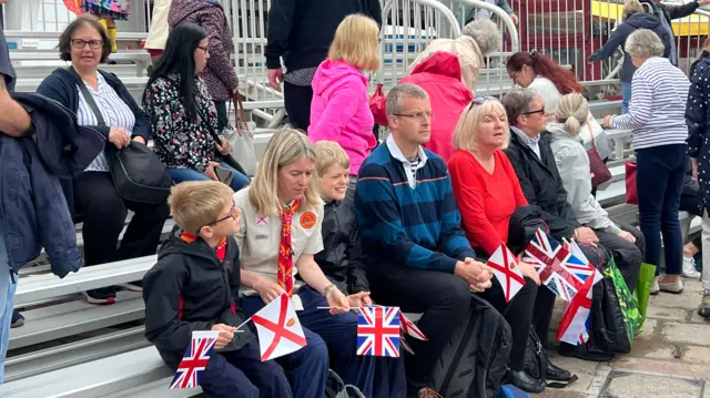 Crowds taking their seats for the royal visit