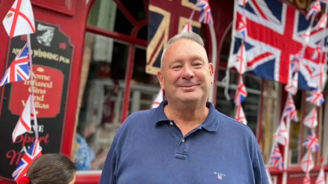 Man stood outside a pub