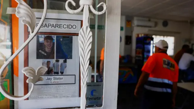 A poster with a photo of Jay Slater is placed in a restaurant in Santiago del Teide, on the island of Tenerife,