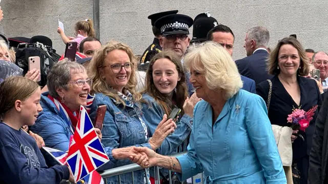 Queen Camilla meeting people in the crowd