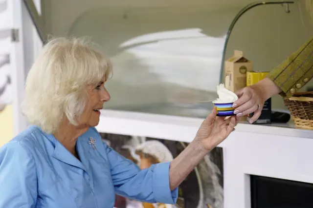 Queen Camilla accepting an ice cream