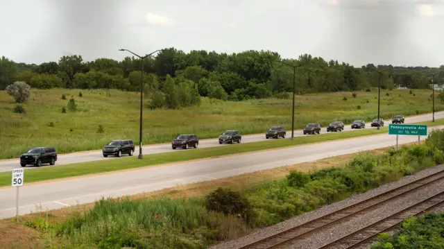 Line of black cars on highway