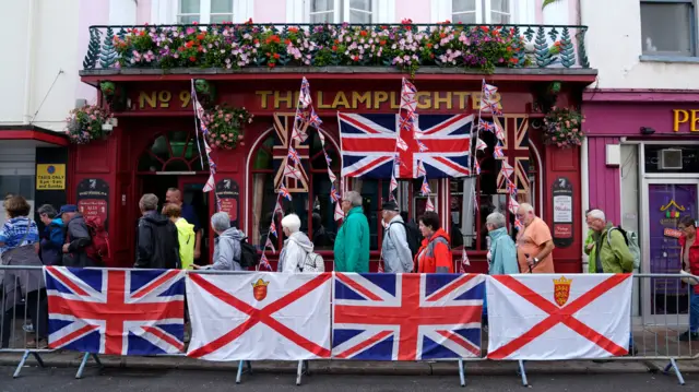 Outside of the Lamplighter pub in St Helier, covered in flags for the royal visit