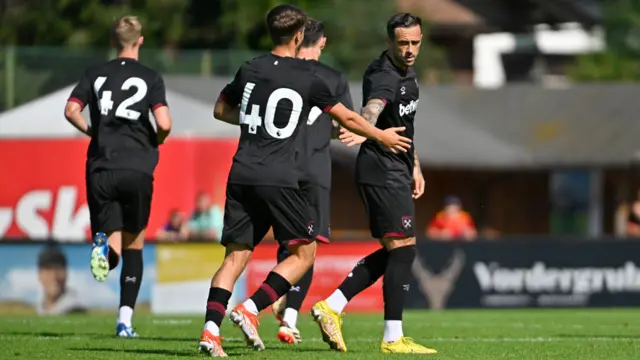 Danny Ings celebrates with teammates after scoring a free-kick against Ferencvaros