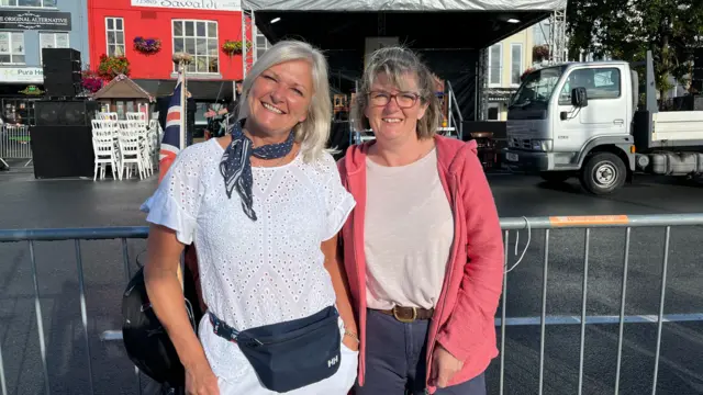 Women stood next to a barrier