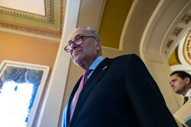 New Jersey Senator Chuck Schumer walks through Congress