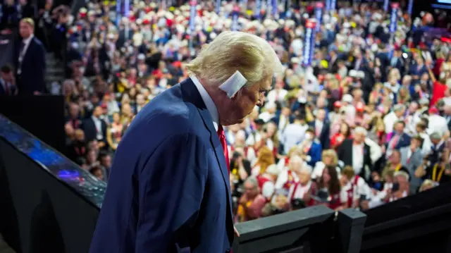 Republican presidential nominee and former U.S. President Donald Trump walks during Day 1 of the Republican National Convention (RNC) at the Fiserv Forum in Milwaukee, Wisconsin, US