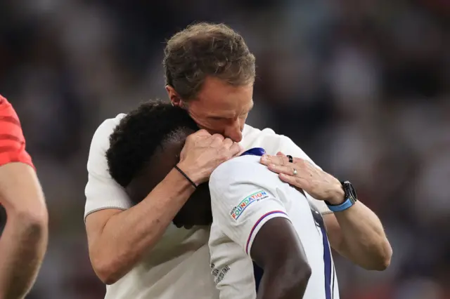 Gareth Southgate hugs Bukayo Saka