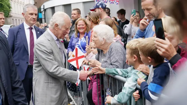 King Charles III speaks to members of the public as he arrives at the Royal Square in St Helier, Jersey.