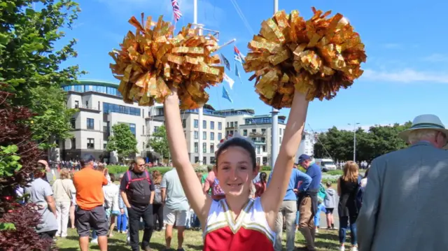 Maisy with her cheerleader pompoms