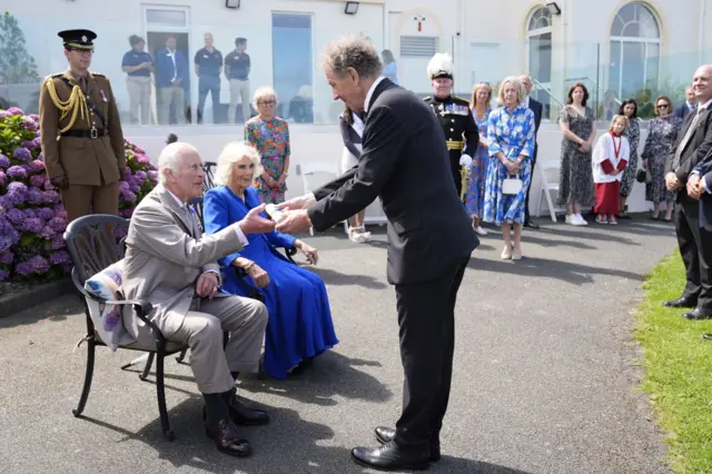 King Charles III and Queen Camilla are presented with the loyal address from Alderney, during a visit to Les Cotils at L'Hyvreuse, in St Peter Port, Guernsey.