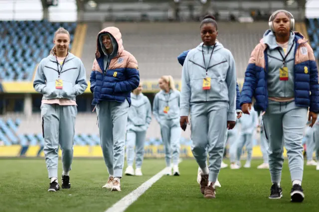 England players walk around the pitch