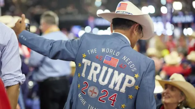 Image shows man in Trump jacket