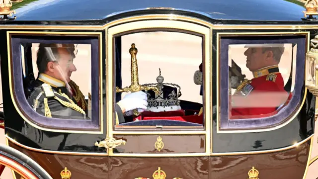 A carriage carrying Sir George Michael Zambellas leaves Buckingham Palace