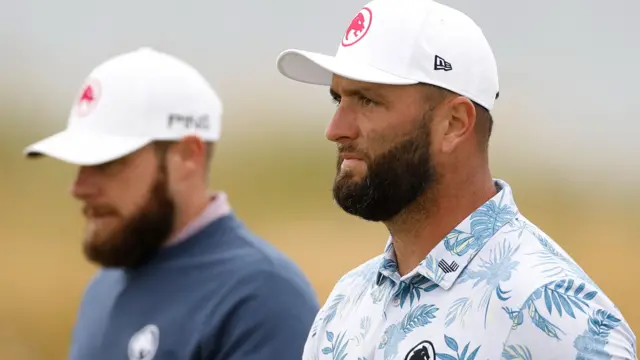 Jon Rahm looks on during a practice round