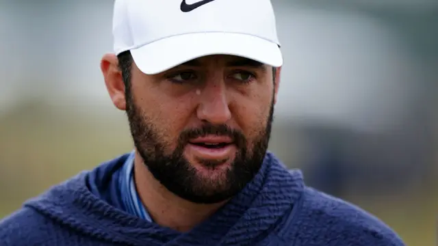 Scottie Scheffler looks on during a practice round