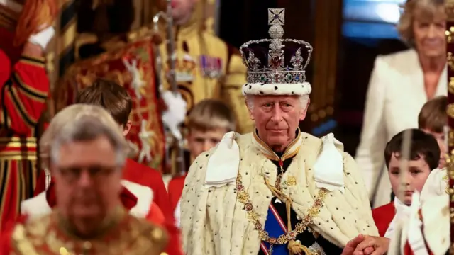 Britain's King Charles wears the Imperial State Crown on the day of the State Opening of Parliament