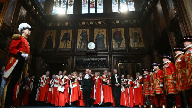 The King's Bodyguard, the Yeomen of the Guard, carry out the ceremonial search of the Palace of Westminster in London, ahead of the State Opening of Parliament in the House of Lords,