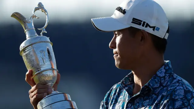 Collin Morikawa holds the Claret Jug