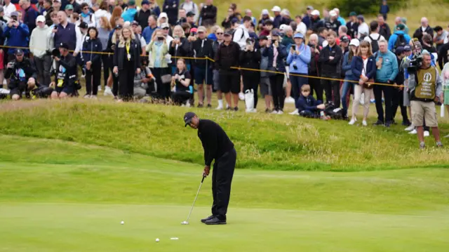 Tiger Woods putts during a practice round