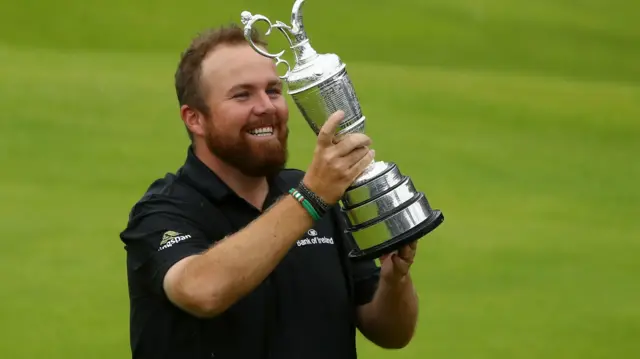 Shane Lowry holds the Claret Jug