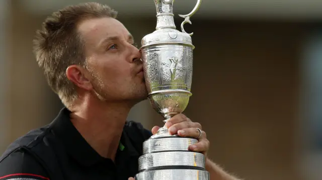 Henrik Stenson kisses the Claret Jug