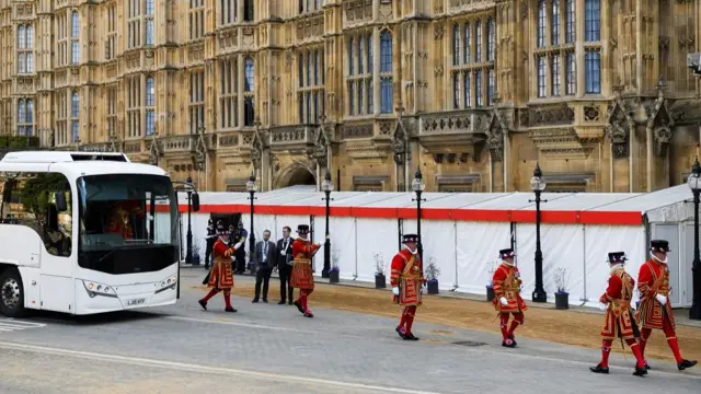 Yeomen of the Guard get off a bus outside the Houses of Parliament