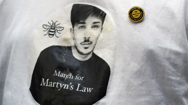 A picture of Martyn Hett, a victim of the Manchester Arena bombing, on a T-shirt.