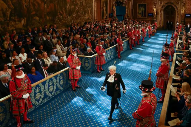 Black Rod Sarah Clarke walks through the Royal Gallery on the day of the State Opening of Parliament, in the House of Lords at the Palace of Westminster in London