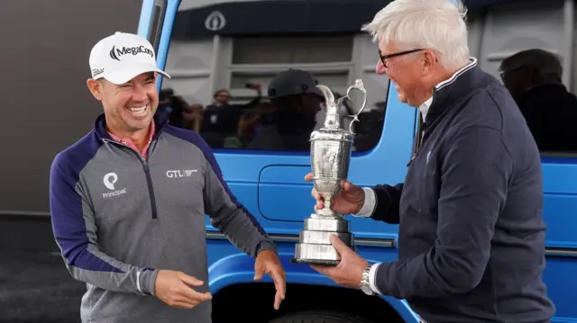 Brian Harman hands back the Claret Jug