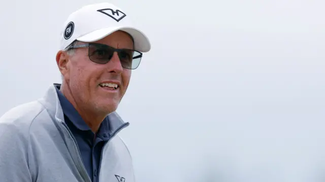 Phil Mickelson smiles during a practice round