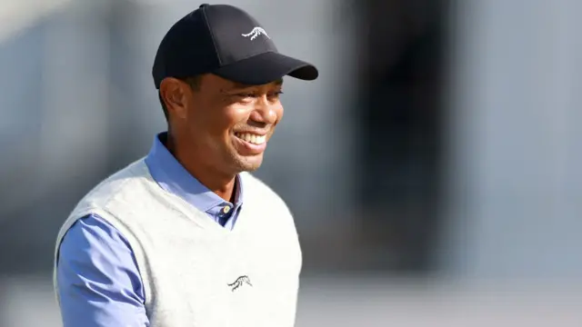 Tiger Woods smiles during a practice round