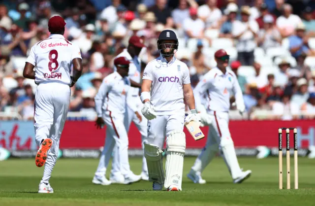 England's Ben Duckett walks back to the pavilion after losing his wicket, caught out by West Indies' Jason Holder off the bowling of Shamar Joseph