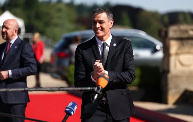 Spanish Prime Minister Pedro Sanchez reacts as he arrives to attend the European Political Community meeting at Blenheim Palace