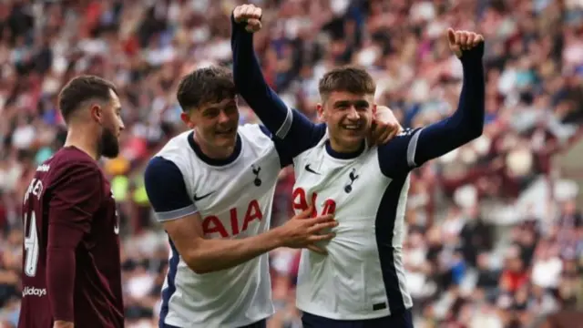 Mikey Moore of Tottenham Hotspur celebrates after he scores his team's second goal during the Pre-Season Friendly between Heart of Midlothian and Tottenham Hotspur at Tynecastle Stadium on July 17, 2024 in Edinburgh, Scotland.