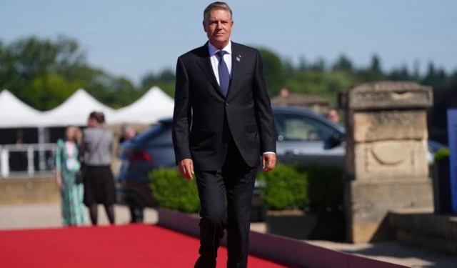 President of Romania Klaus Iohannis arrives to attend the European Political Community summit at Blenheim Palace in Woodstoc