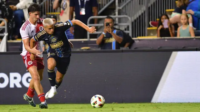 Philadelphia Union midfielder Cavan Sullivan (6) moves the ball past New England Revolution midfielder Ian Harkes (14) during the second half at Subaru Park.