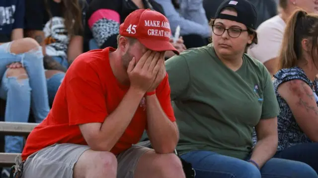 A Trump supporters with head in hands