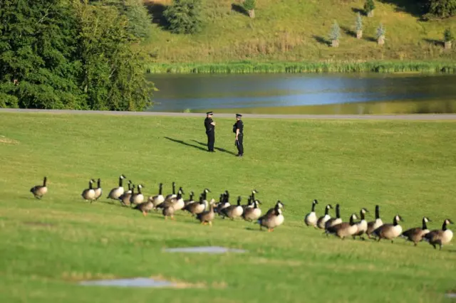 Police officers stand guard in the grounds of Blenheim Palace.