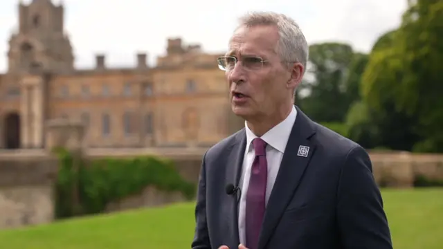 Nato chief Jens Stoltenberg standing in front of Blenheim Palace