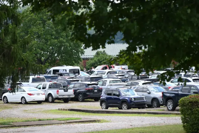 Funeral attendees parked their cars outside the visitation