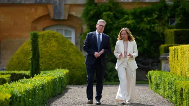 Britain's Prime Minister Keir Starmer talks with Italy's Prime Minister Giorgia Meloni during a bilateral meeting at the European Political Community Summit