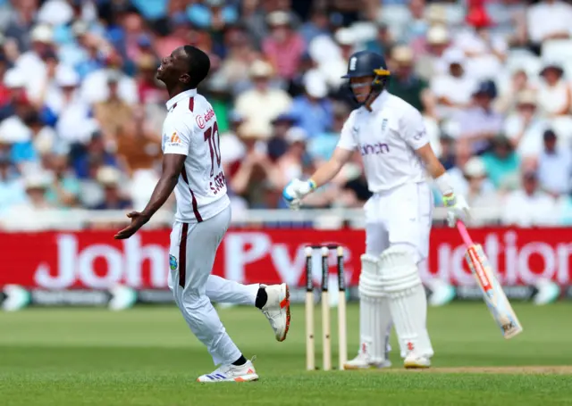 West Indies' Shamar Joseph reacts after England's Ollie Pope was dropped by Jason Holder