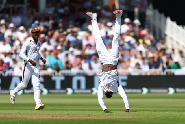 West Indies' Kevin Sinclair celebrates after taking the wicket of England's Harry Brook, caught out by Kirk McKenzie