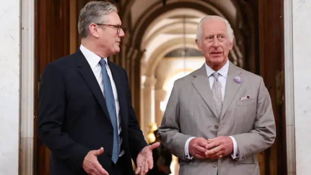 Britain's King Charles stands with Britain's Prime Minister Keir Starmer during the European Political Community