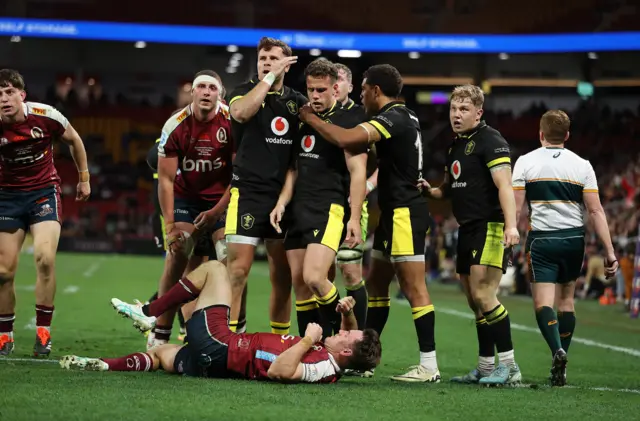 Wales players celebrate Kieran Hardy's late try