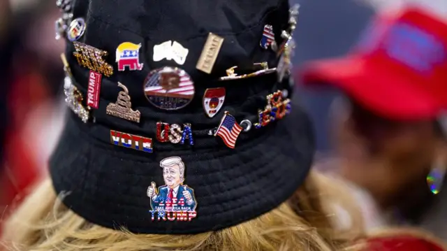 MAGA brooch on Trump supporter's hat