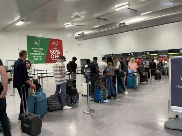 Queuing passengers at East Midlands Airport