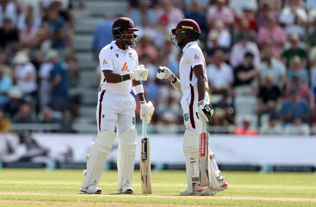 Kavem Hodge (L) and Alick Athanaze of the West Indies drives the ball for four runs Alick Athanaze touch gloves during Day two of the 2nd Test Match between England and the West Indies