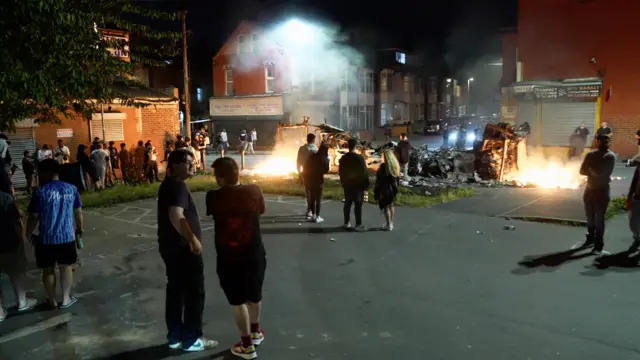 People around the wrecked bus